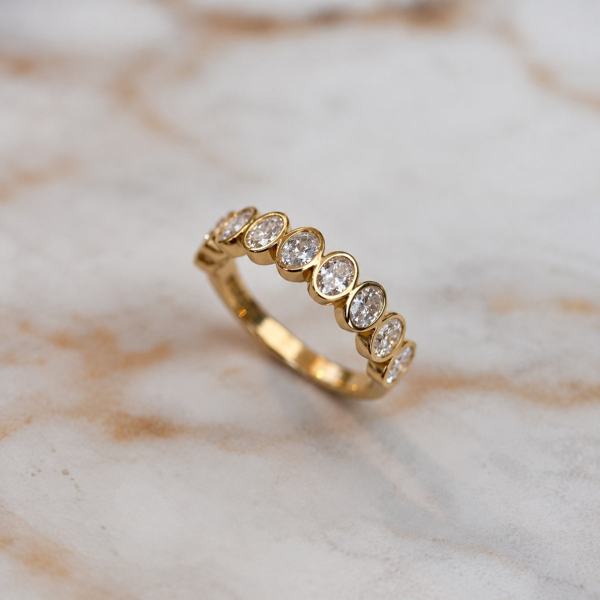 Oval bezel set half band - 0.80ct+