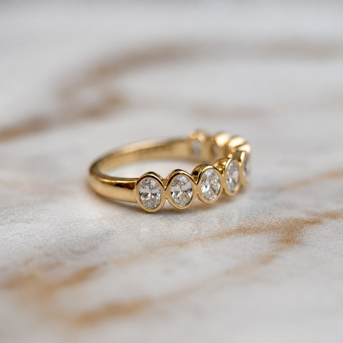 Oval bezel set half band - 0.80ct+