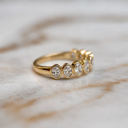 Oval bezel set half band - 0.80ct+