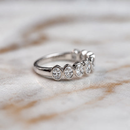 Oval bezel set half band - 0.80ct+