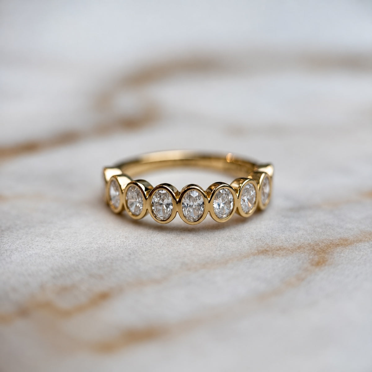 Oval bezel set half band - 0.80ct+