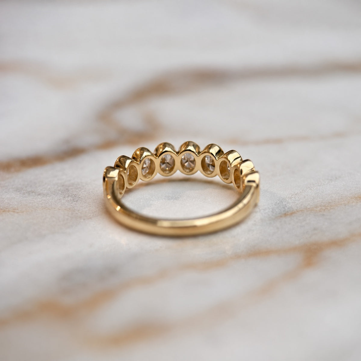 Oval bezel set half band - 0.80ct+