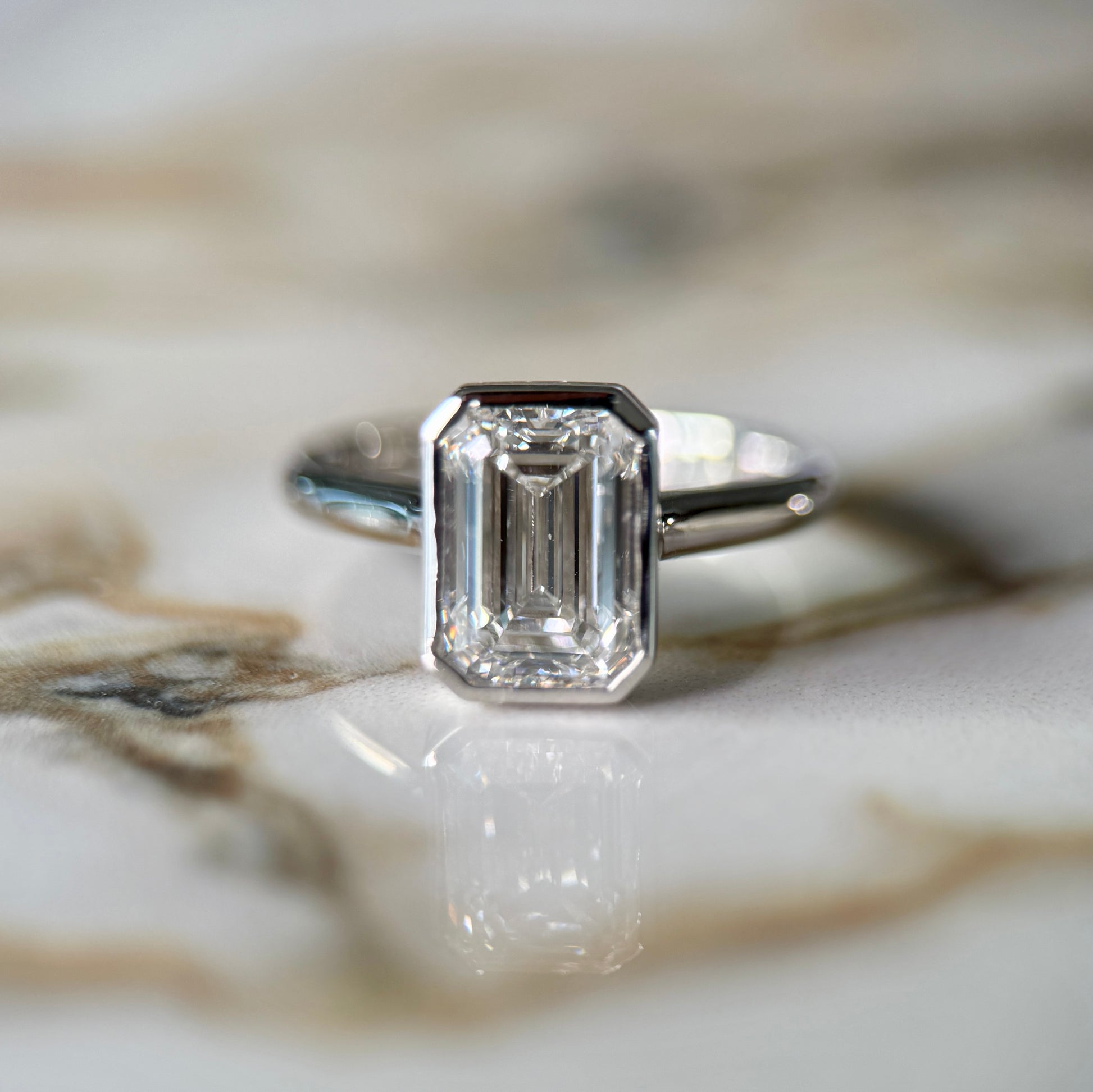 London Diamonds Bezel Set Classic Emerald Cut Solitaire - 2ct+ (10mm+, D/E & VVS)