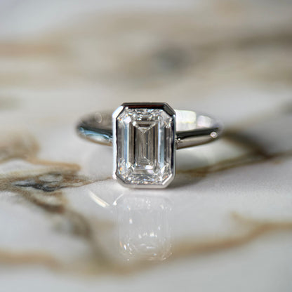 London Diamonds Bezel Set Classic Emerald Cut Solitaire - 2ct+ (10mm+, D/E & VVS)