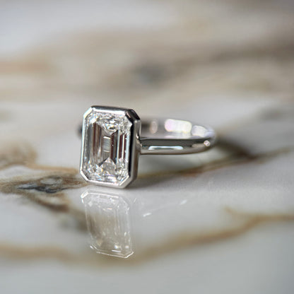 London Diamonds Bezel Set Classic Emerald Cut Solitaire - 2ct+ (10mm+, D/E & VVS)