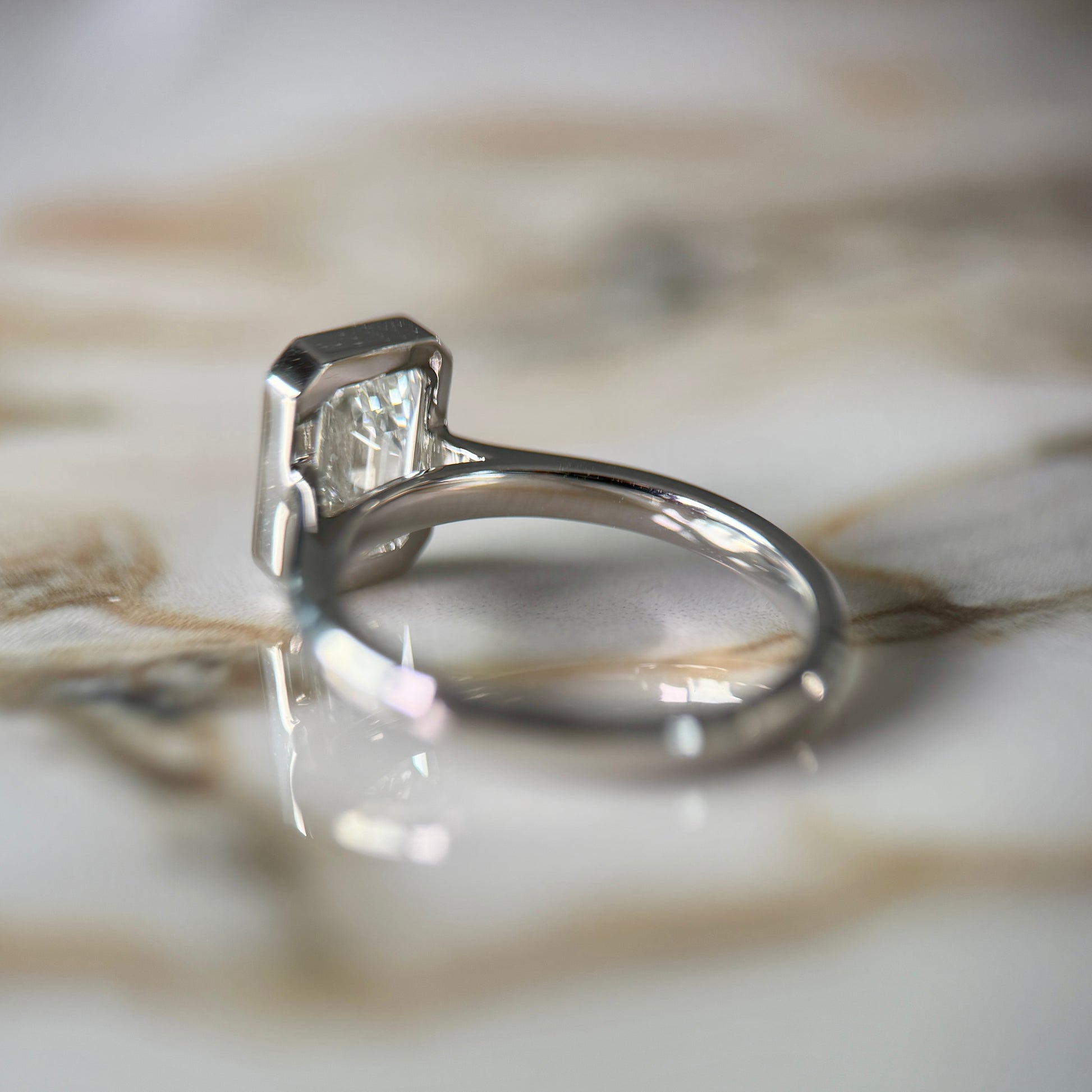 London Diamonds Bezel Set Classic Emerald Cut Solitaire - 2ct+ (10mm+, D/E & VVS)