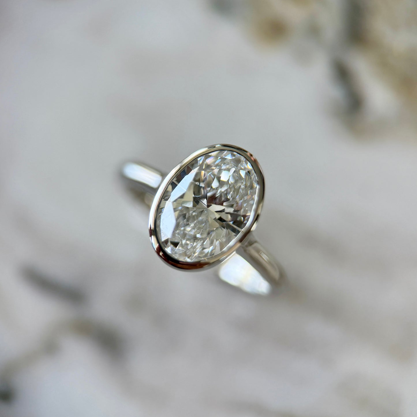 London Diamonds Bezel Set Classic Oval Cut Solitaire - 2ct+ (10mm+, D/E & VVS)