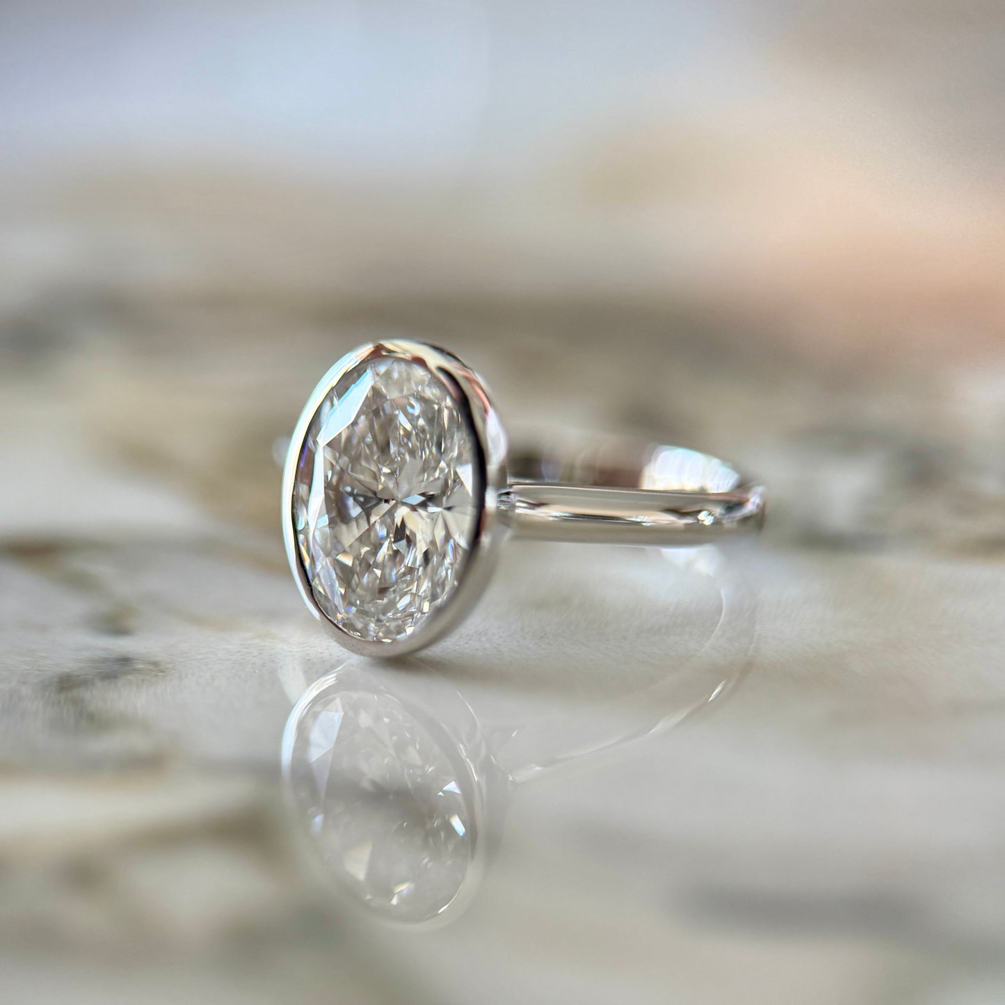 London Diamonds Bezel Set Classic Oval Cut Solitaire - 2ct+ (10mm+, D/E & VVS)