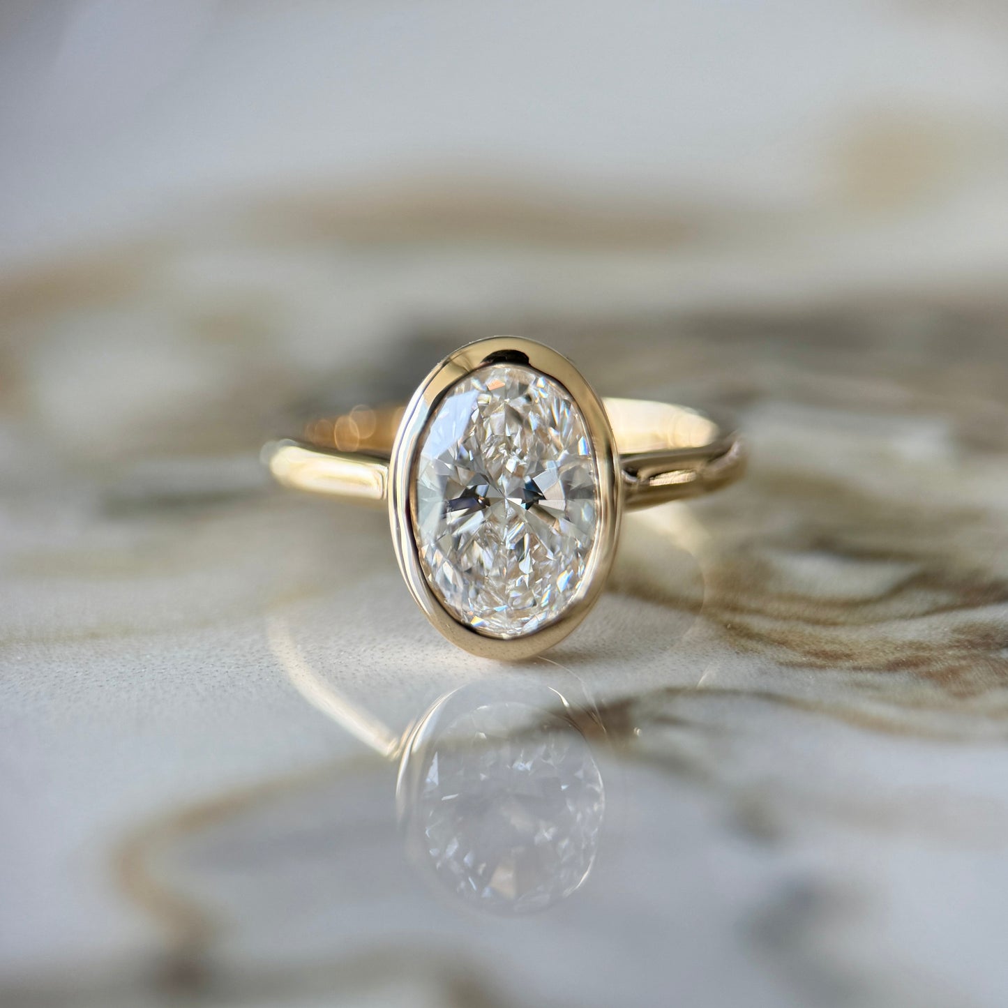 London Diamonds Bezel Set Classic Oval Cut Solitaire - 2ct+ (10mm+, D/E & VVS)