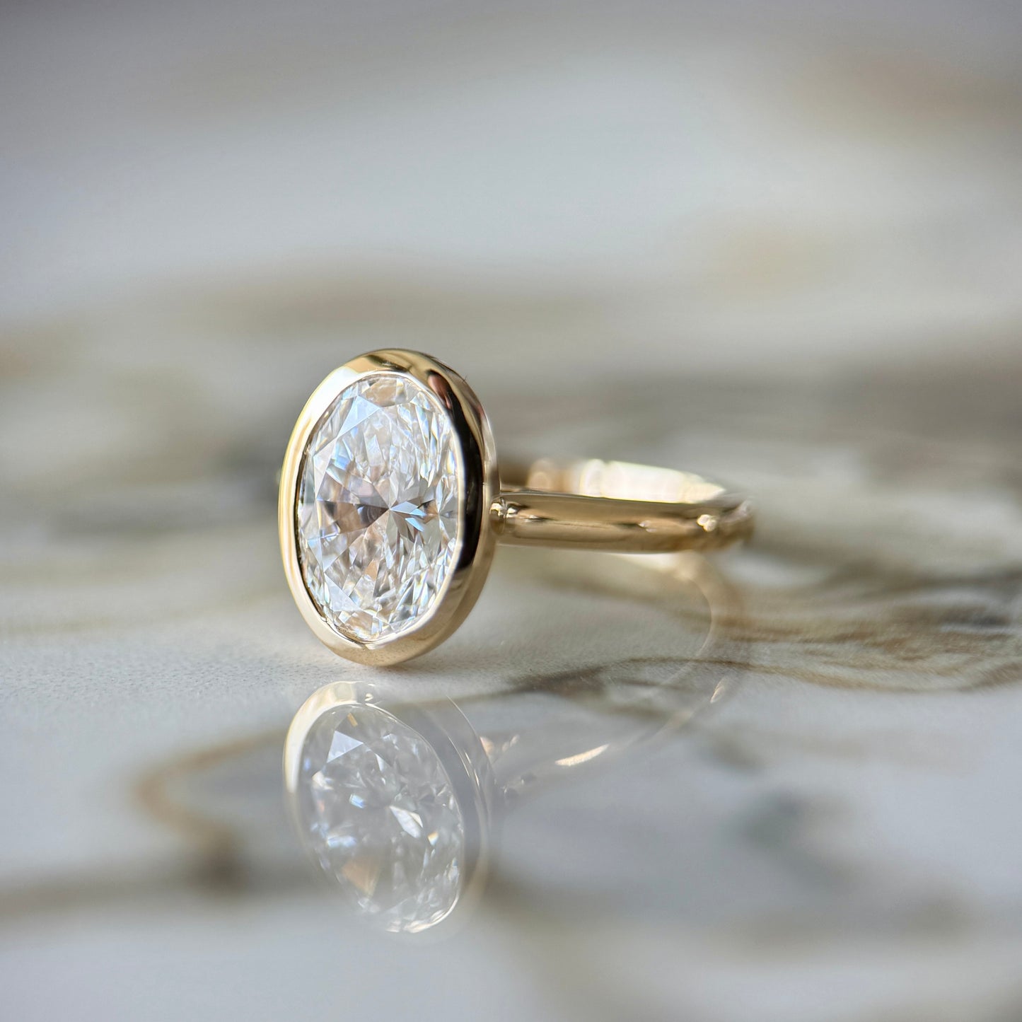 London Diamonds Bezel Set Classic Oval Cut Solitaire - 2ct+ (10mm+, D/E & VVS)