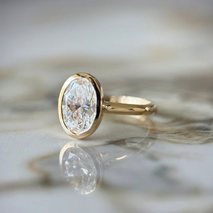 London Diamonds Bezel Set Classic Oval Cut Solitaire - 2ct+ (10mm+, D/E & VVS)