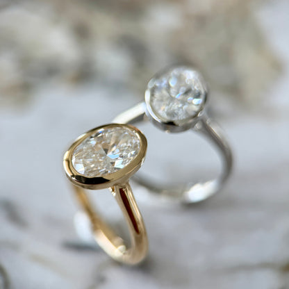 London Diamonds Bezel Set Classic Oval Cut Solitaire - 2ct+ (10mm+, D/E & VVS)