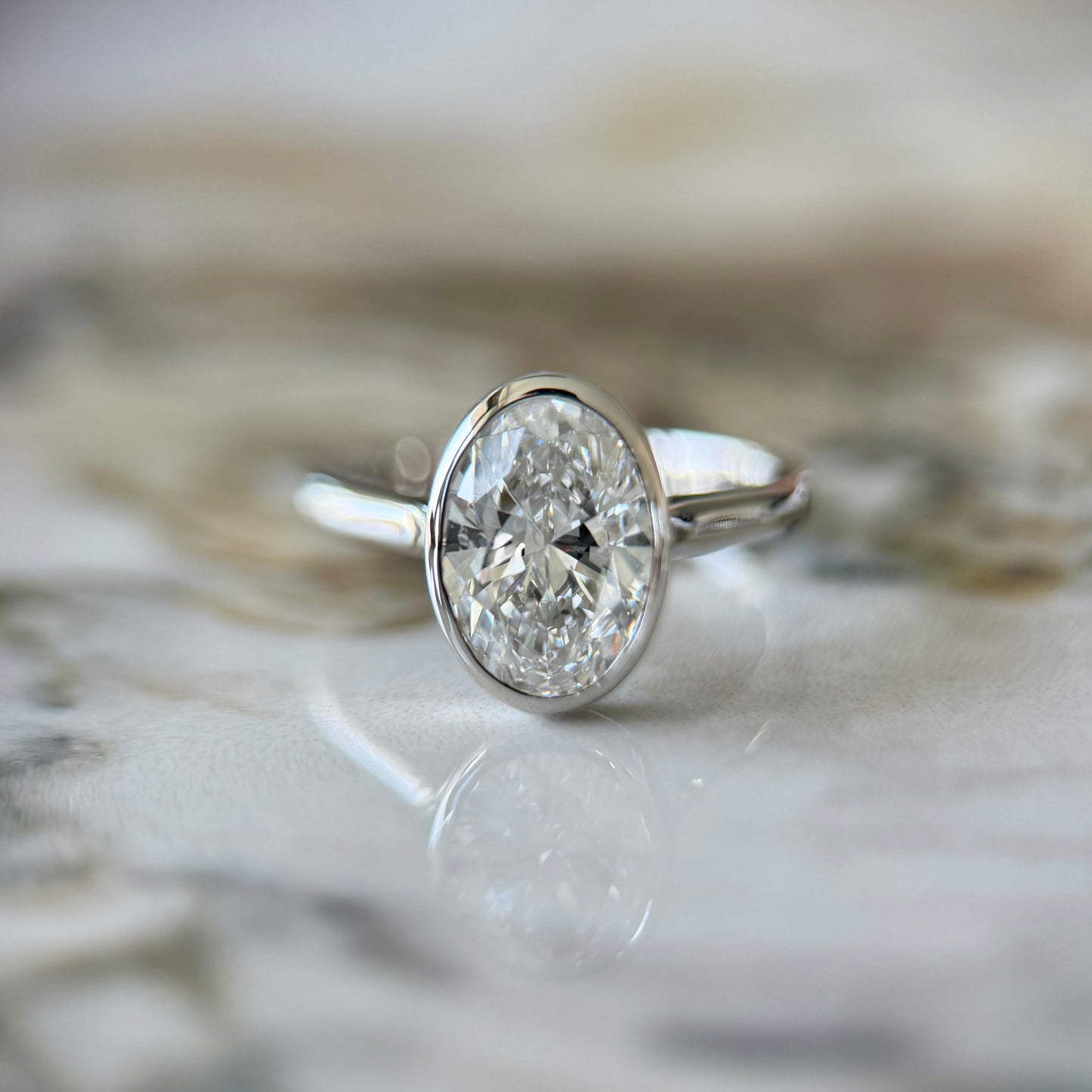 London Diamonds Bezel Set Classic Oval Cut Solitaire - 2ct+ (10mm+, D/E & VVS)