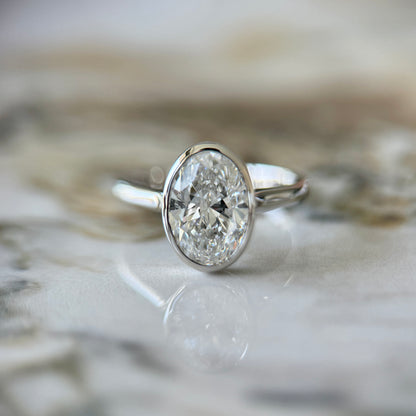 London Diamonds Bezel Set Classic Oval Cut Solitaire - 2ct+ (10mm+, D/E & VVS)