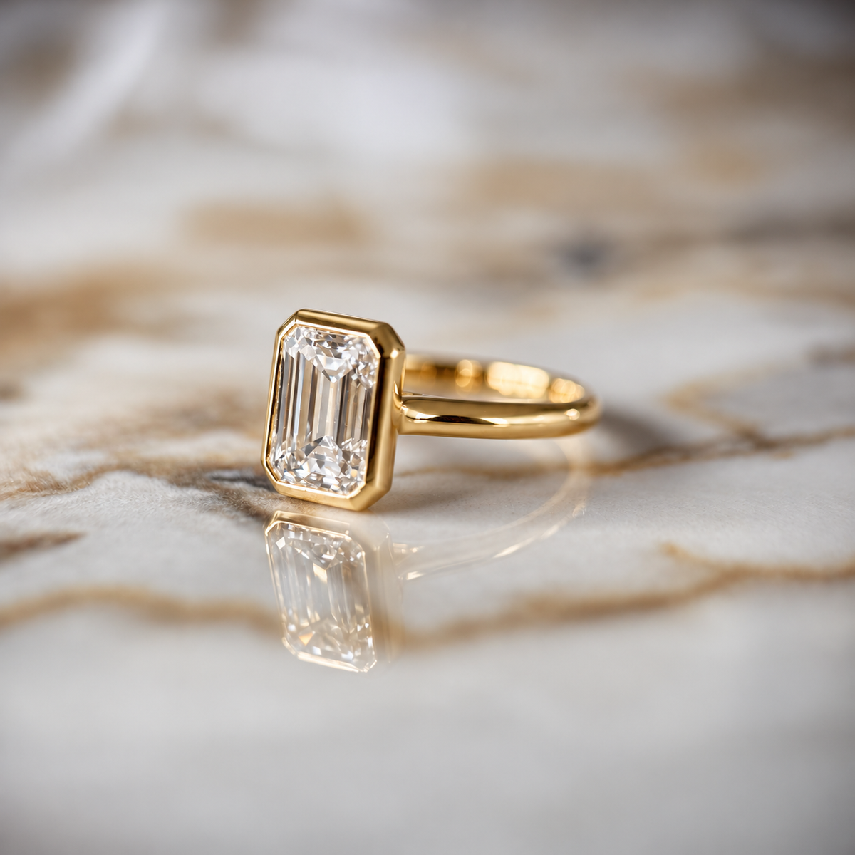 Bezel Set Classic Emerald Cut Solitaire - 2ct+ (D/E & VVS)