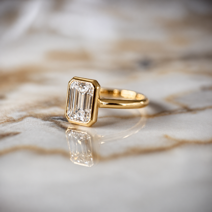 Bezel Set Classic Emerald Cut Solitaire - 2ct+ (D/E & VVS)